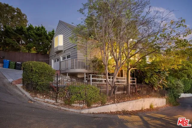a kitchen with stainless steel appliances granite countertop a stove a sink and a granite counter tops with white cabinets