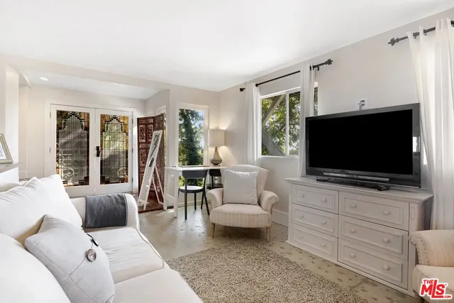 a kitchen with stainless steel appliances granite countertop a sink and refrigerator