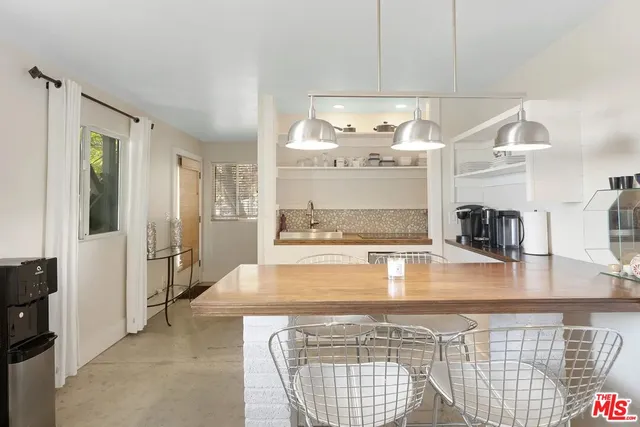 a kitchen with counter top space and stove