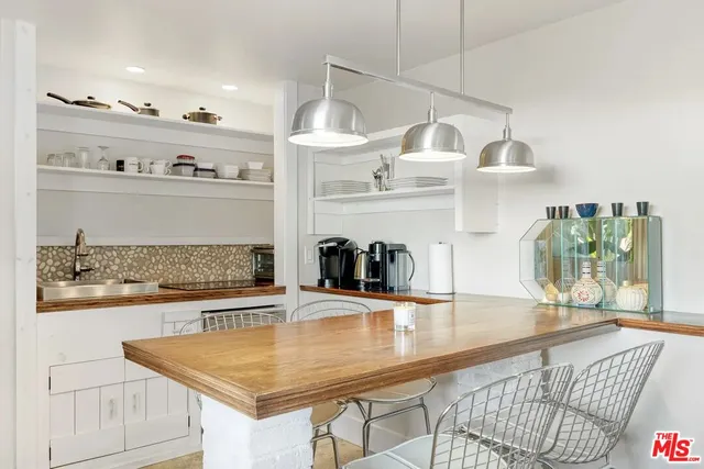 a bathroom with a sink a mirror and shower
