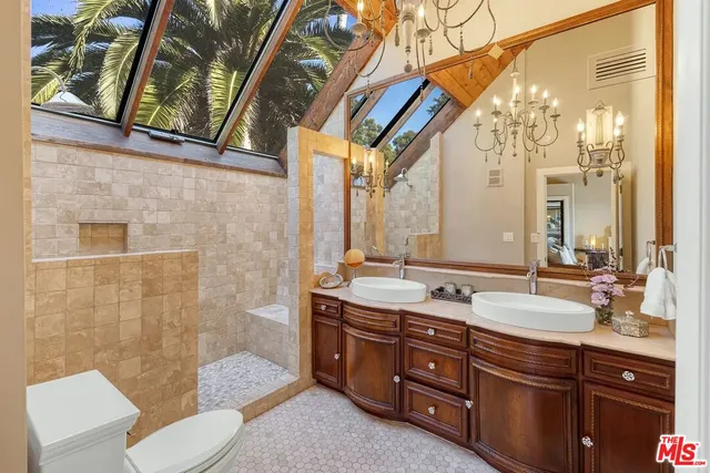 an aerial view of house with ocean view