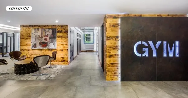 a outdoor kitchen with stainless steel appliances kitchen island granite countertop a table and chairs in it