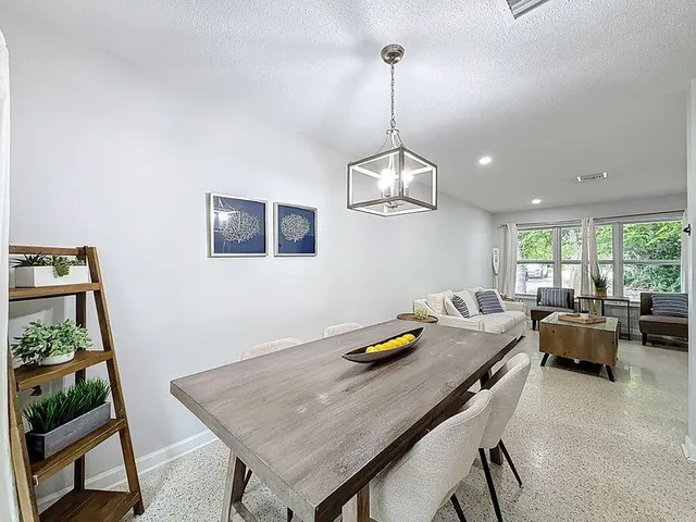 a view of a workspace with furniture