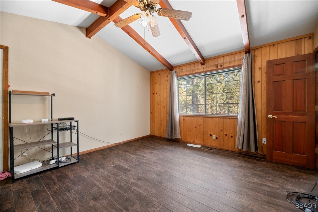 252 Riverside Avenue Sugarloaf, CA 92386 - Photo 19 of 29 an empty room with wooden floor and windows