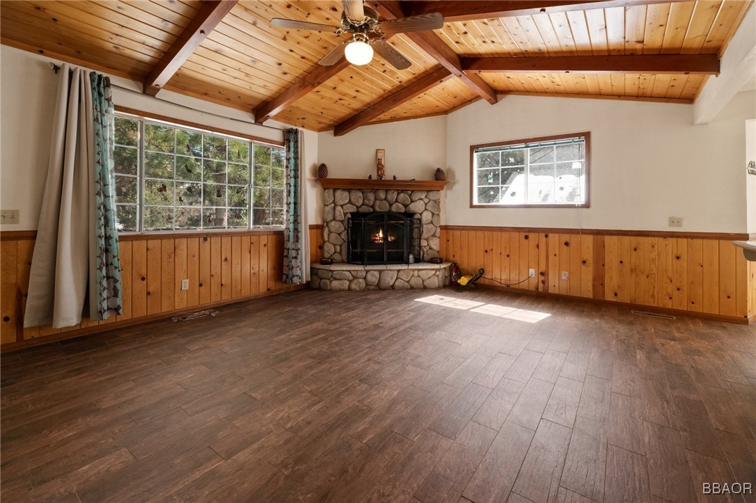 252 Riverside Avenue Sugarloaf, CA 92386 - Photo 4 of 29 a view of an empty room with wooden floor and a window