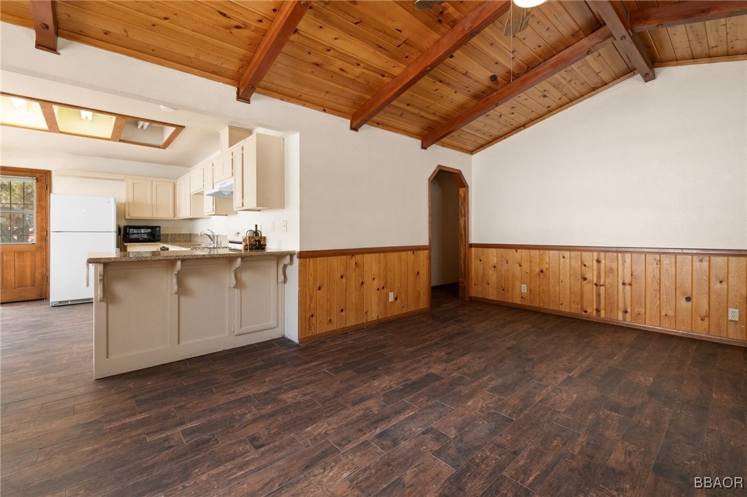 252 Riverside Avenue Sugarloaf, CA 92386 - Photo 6 of 29 a view of a kitchen with a sink and dishwasher with wooden floor