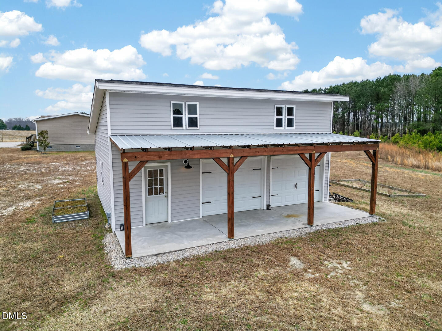 540 Pine Ridge Road Zebulon, NC 27597 - Photo 55 of 96 a front view of a house with garage