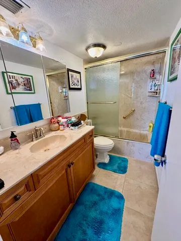 a bath room with a sink and a mirror