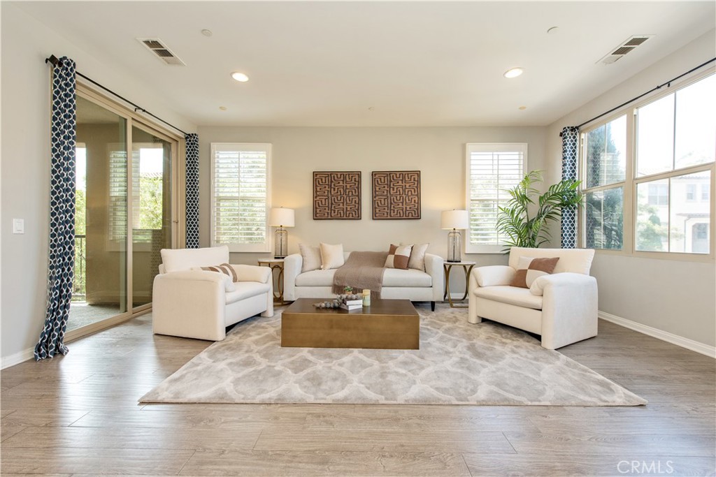 68 Origin Irvine, CA 92618 - Photo 14 of 43 a living room with furniture and a large window