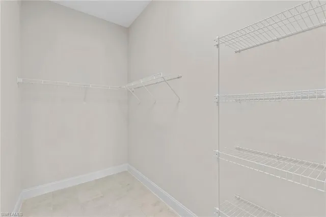 a bathroom with double vanity sink and a mirror