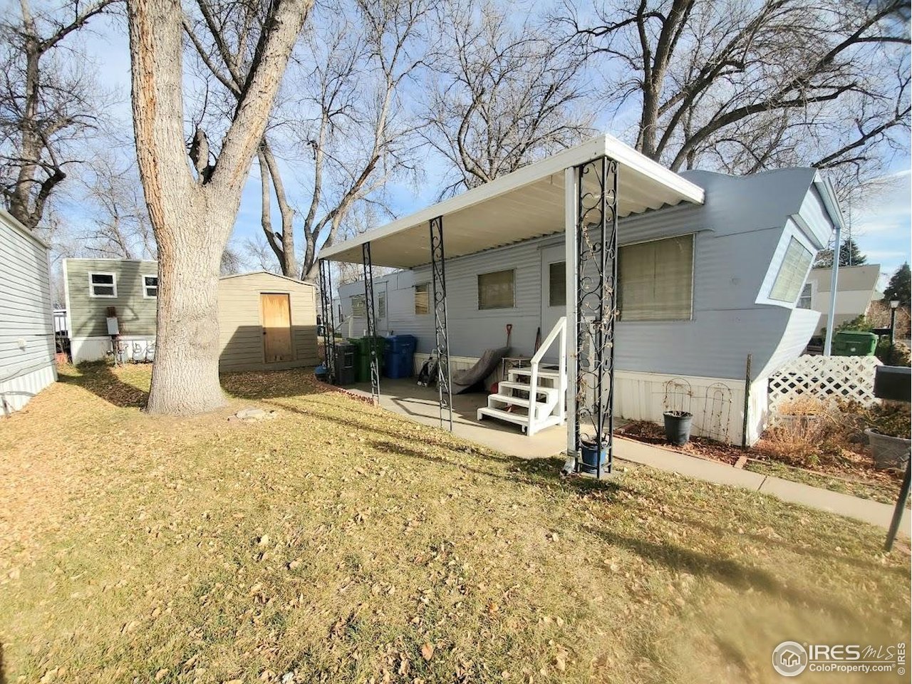 1700 Laporte Avenue, Unit 4 Fort Collins, CO 80521 - Photo 3 of 25 a view of a house with a yard covered in snow