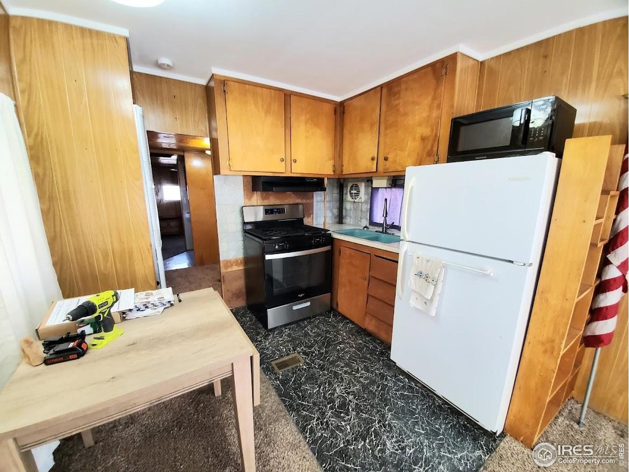 1700 Laporte Avenue, Unit 4 Fort Collins, CO 80521 - Photo 7 of 25 a kitchen with stainless steel appliances a refrigerator sink and stove