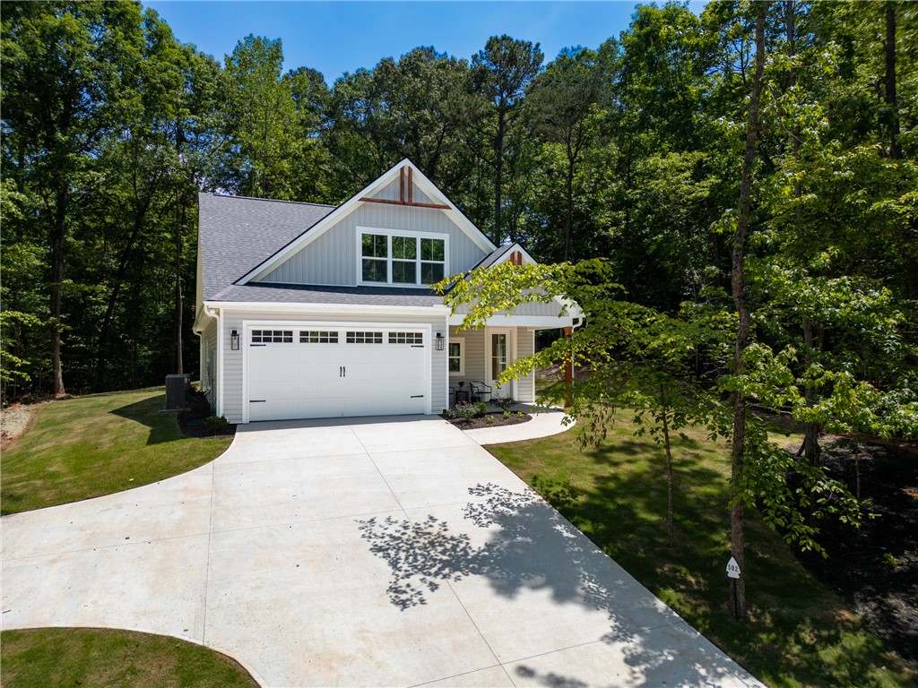 502 Point Road Westminster, SC 29693 - Photo 1 of 45 A newly constructed residence offers a generous concrete driveway and a welcoming covered entrance.