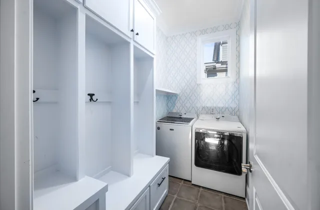 a view of walk in closet with clothes