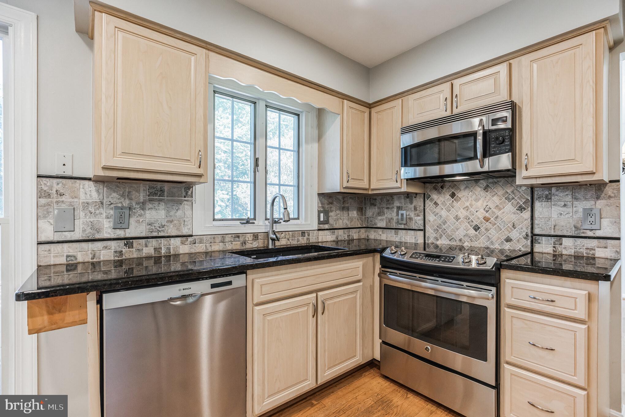 6206 Winnepeg Drive Burke, VA 22015 - Photo 5 of 29 Kitchen with Granite Tops and Stainless Appliances