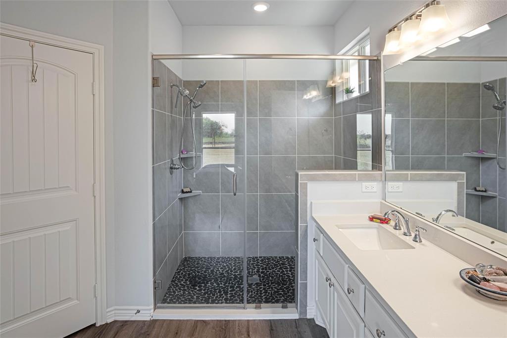 475 Massey Road Gunter, TX 75058 - Photo 30 of 34 Glass-enclosed shower with a pebble floor and tiled walls