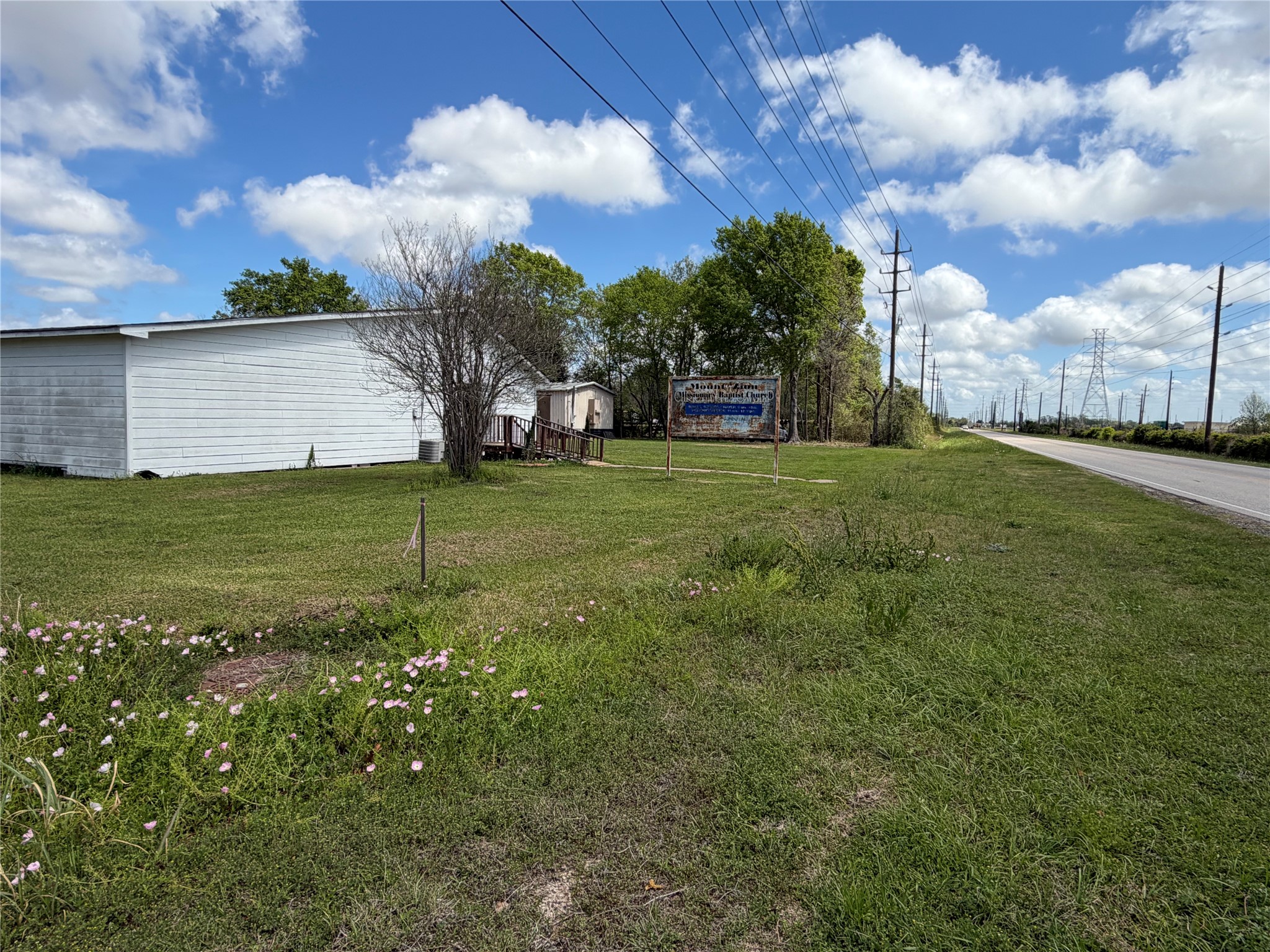 26630 Betka Road Hockley, TX 77447 - Photo 4 of 11 a view of a garden with a building in the background