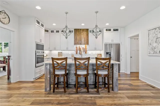 a kitchen with a sink cabinets and window