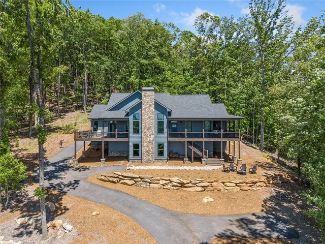 front view of a house with a tree