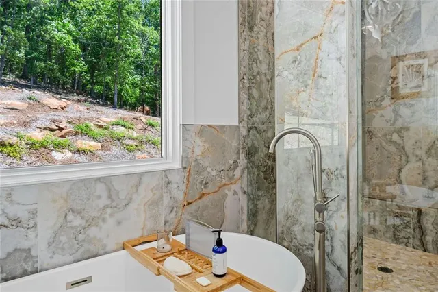 a bedroom with a bed a mirror and a window