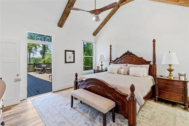 a bathroom with a granite countertop sink a mirror a shower and vanity