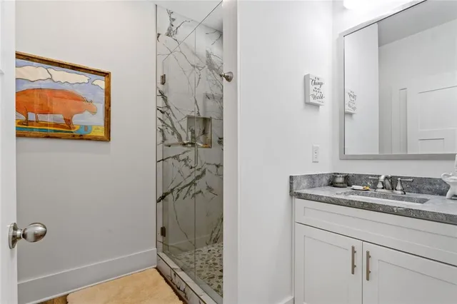 a view of a patio with a table and chairs and floor to ceiling window