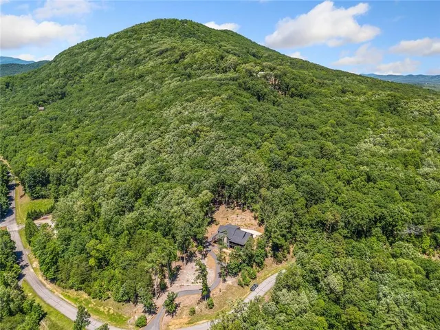 a living room with furniture fireplace and a flat screen tv