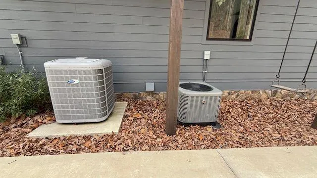 a view of a lake with houses in the back