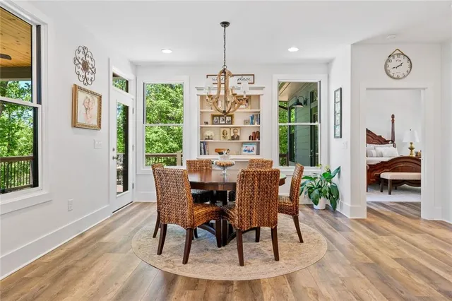 a kitchen with cabinets and wooden floor