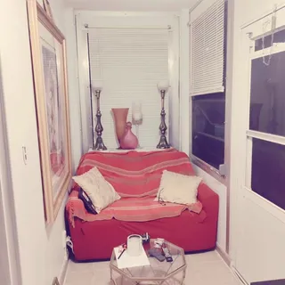 a bedroom with a bed and a mirror