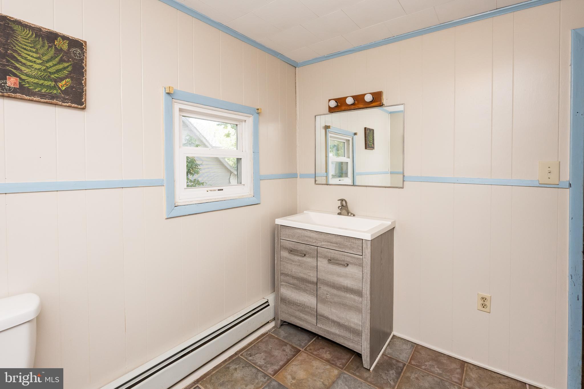 26467 Mariners Road Crisfield, MD 21817 - Photo 33 of 44 a bathroom with a sink and a mirror