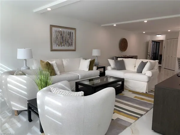 a living room with furniture and a couch