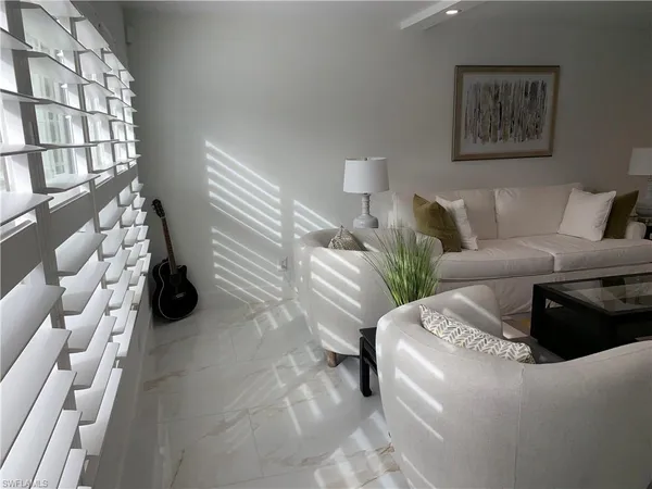 a living room with furniture and a couch