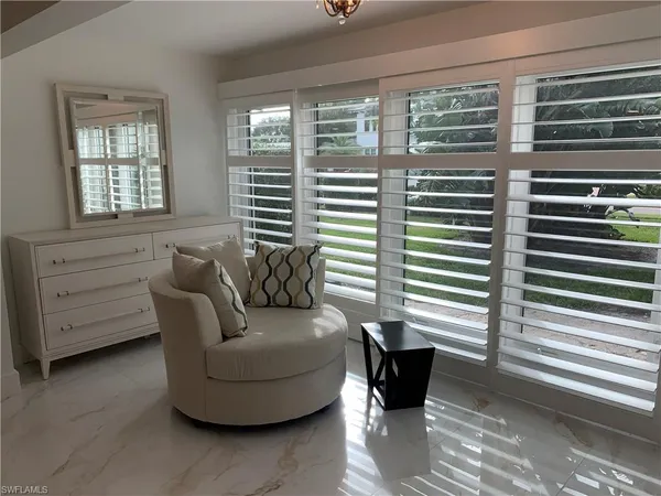 a living room with furniture and windows