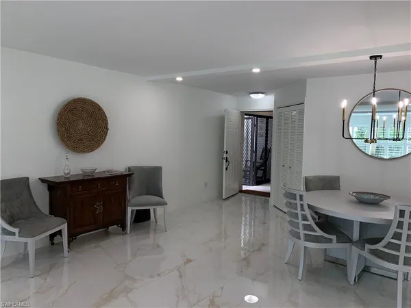 a kitchen with a table and chairs