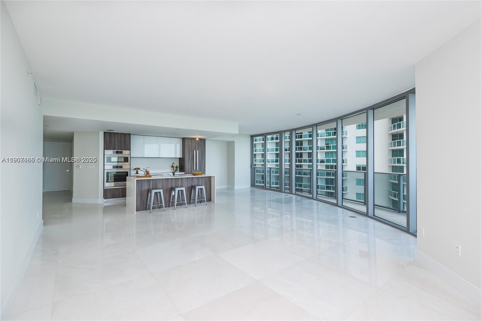 488 Northeast 18th Street, Unit 1815 Miami, FL 33132 - Photo 12 of 31 a view of a livingroom with furniture and window