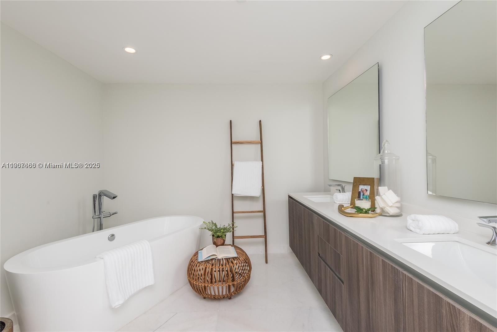 488 Northeast 18th Street, Unit 1815 Miami, FL 33132 - Photo 13 of 31 a spacious bathroom with a granite countertop sink and a bathtub