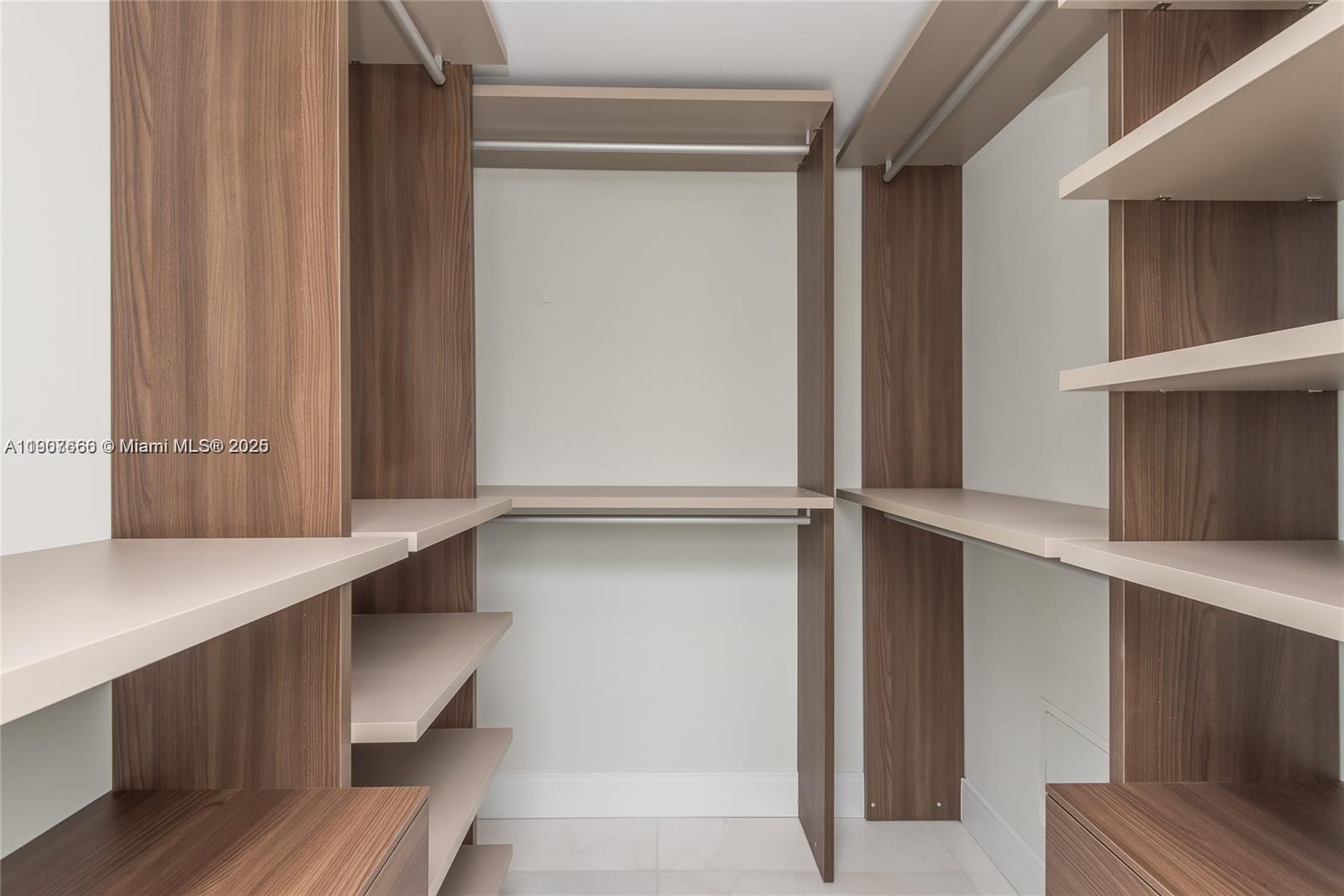 488 Northeast 18th Street, Unit 1815 Miami, FL 33132 - Photo 17 of 31 a view of walk in closet with empty racks
