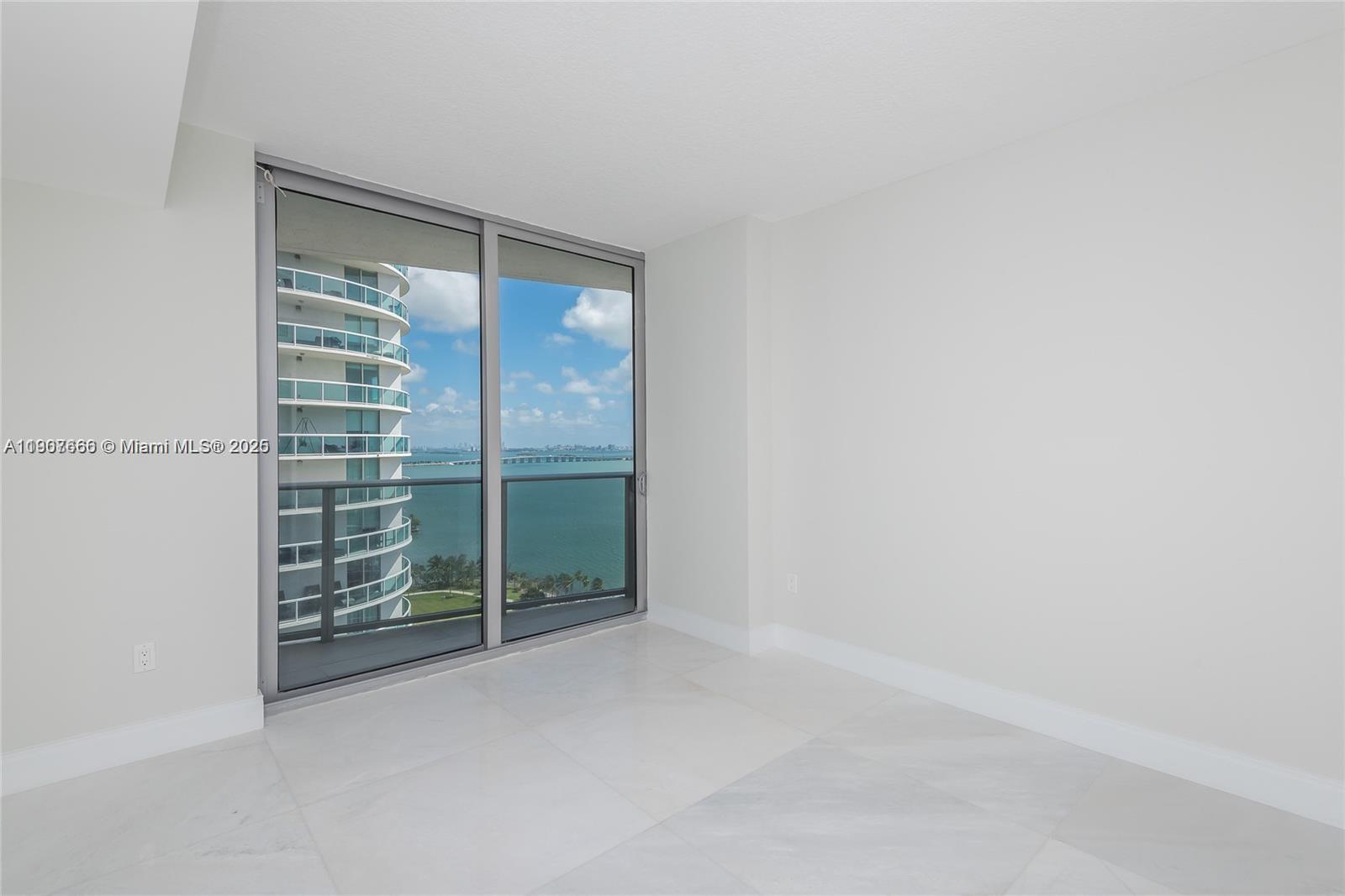 488 Northeast 18th Street, Unit 1815 Miami, FL 33132 - Photo 21 of 31 a view of an empty room with a window