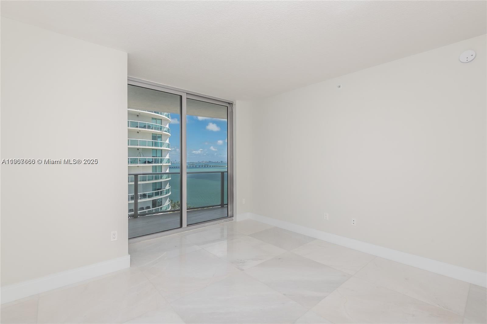 488 Northeast 18th Street, Unit 1815 Miami, FL 33132 - Photo 27 of 31 a view of an empty room with walk in closet
