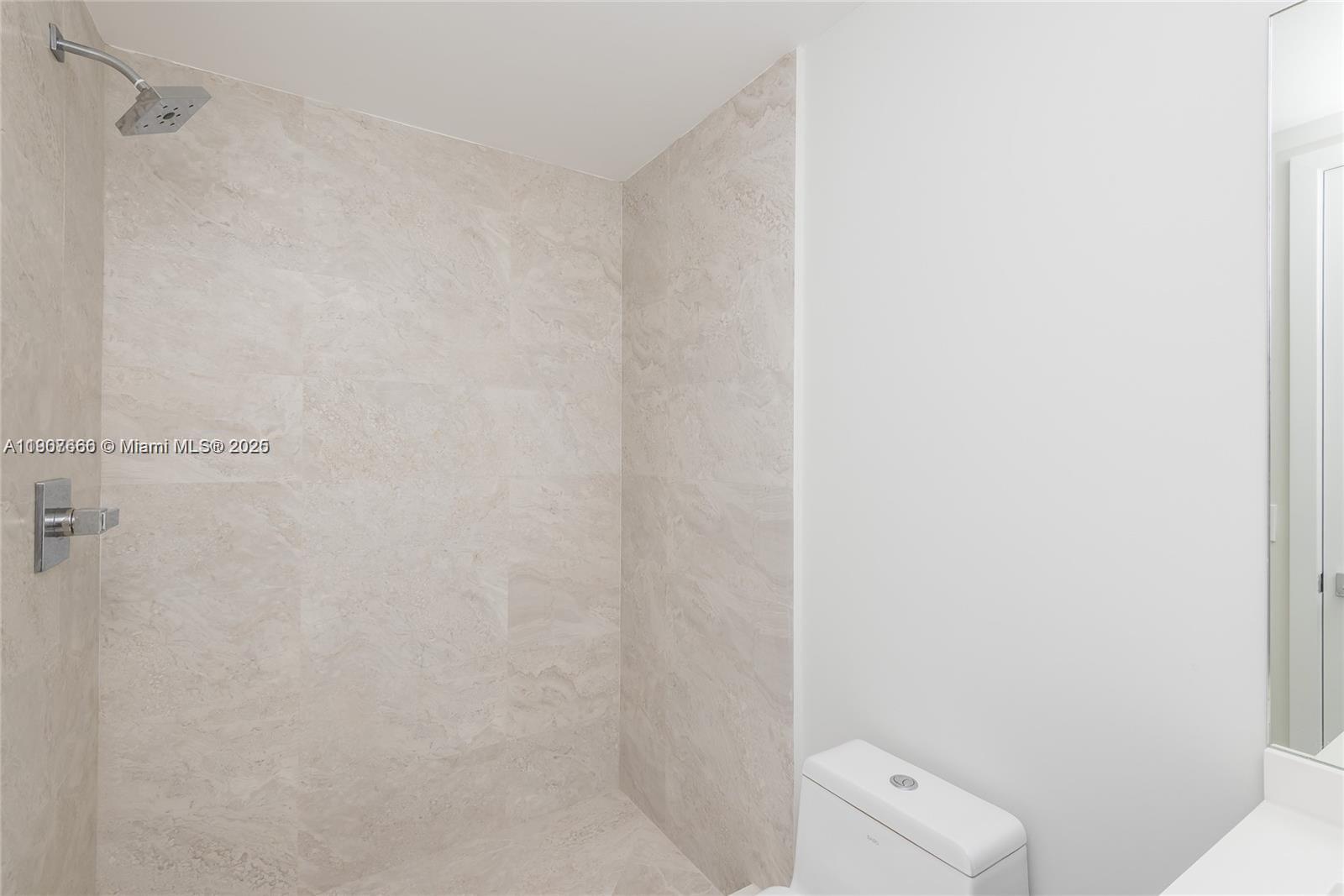 488 Northeast 18th Street, Unit 1815 Miami, FL 33132 - Photo 31 of 31 a bathroom with a shower and toilet