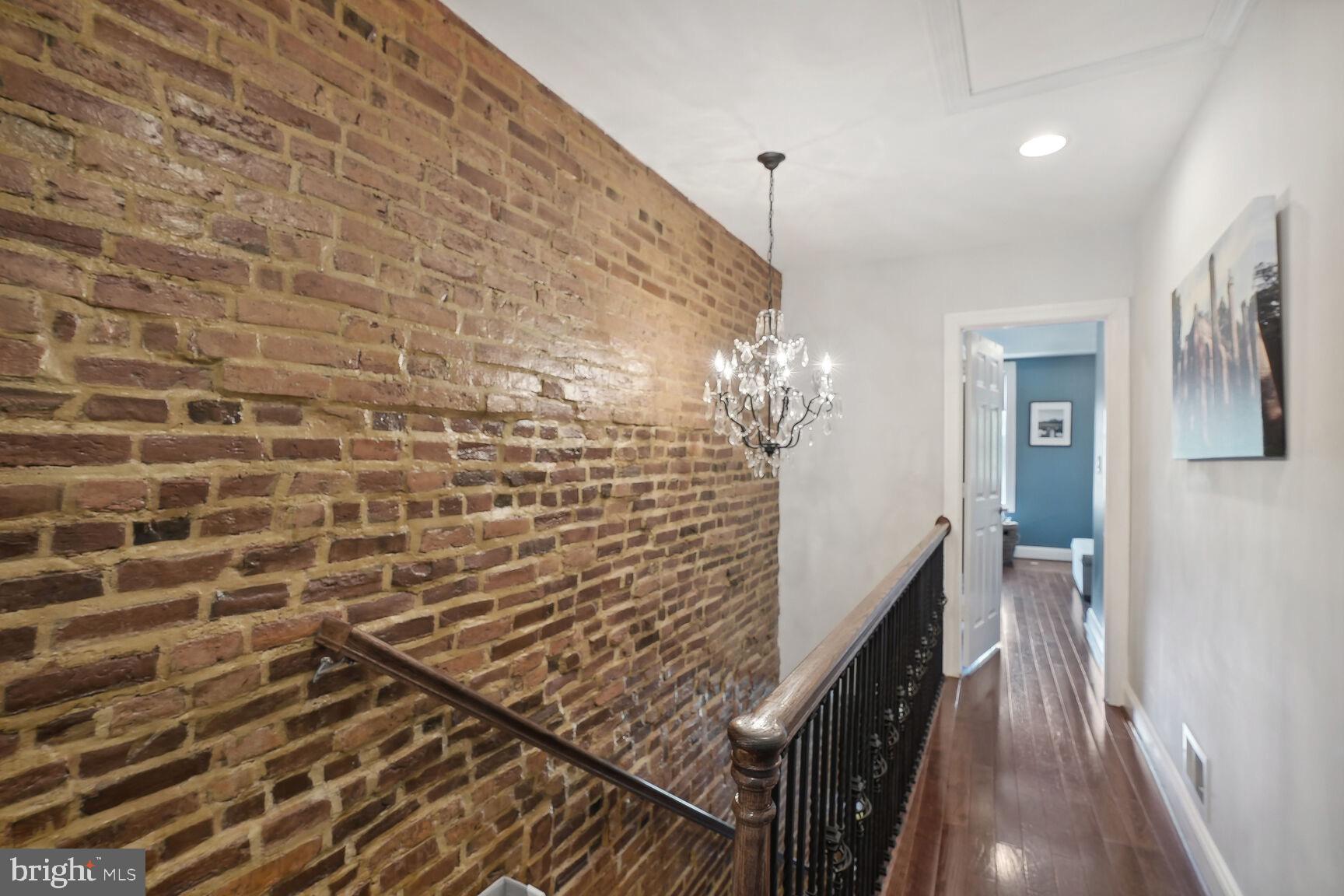 803 9th Street Northeast Washington, DC 20002 - Photo 11 of 22 Exposed brick leading upstairs