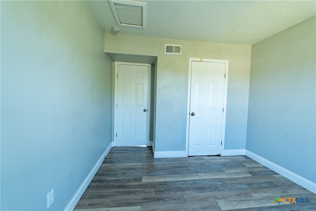 512 Sunset Lane, Unit AD Copperas Cove, TX 76522 - Photo 10 of 23 a view of a hallway with wooden floor