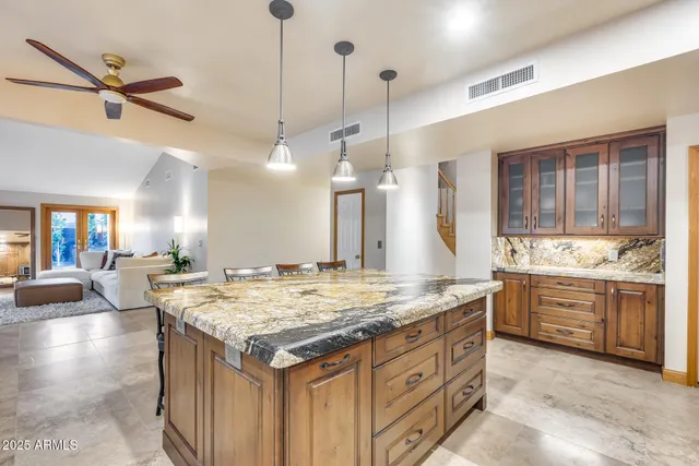 a kitchen with sink stove and refrigerator