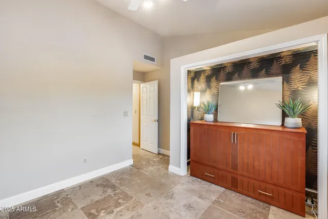 an empty room with mirror