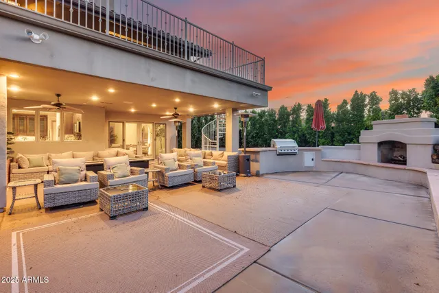 a kitchen with sink refrigerator and couches