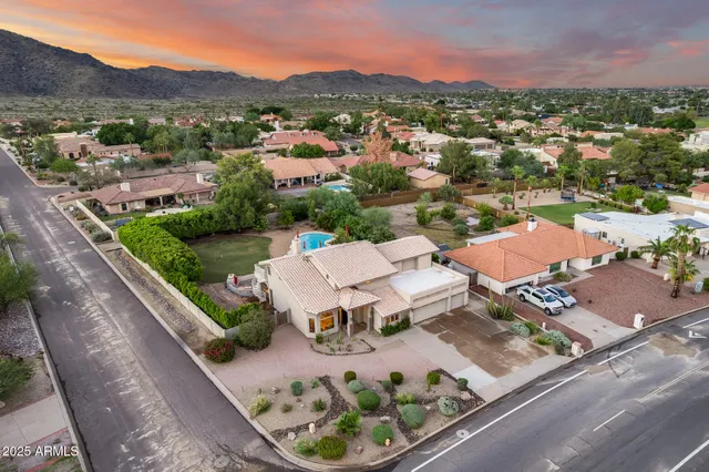 an aerial view of a house with a garden
