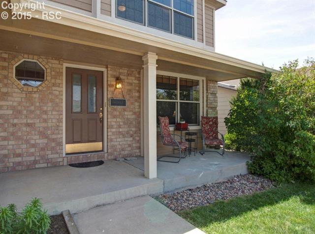 7831 Swiftrun Road Colorado Springs, CO 80920 - Photo 2 of 35 Cozy front porch on a quiet residential street in an awesome location. Close to everything! Schools, parks, shopping... easy commute to PAFB, Schriever, AFA, Powers Blvd...