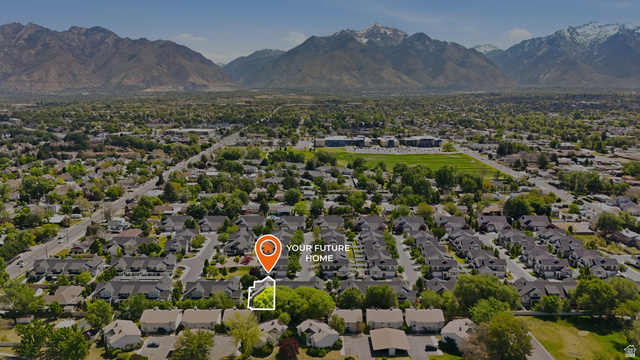 7872 Farm House Lane Midvale, UT 84047 - Photo 37 of 39 Aerial perspective showcasing a residential area with mature trees and a mountain backdrop