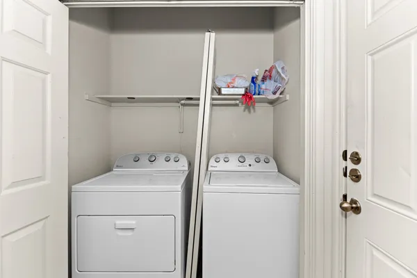 a utility room with dryer and washer